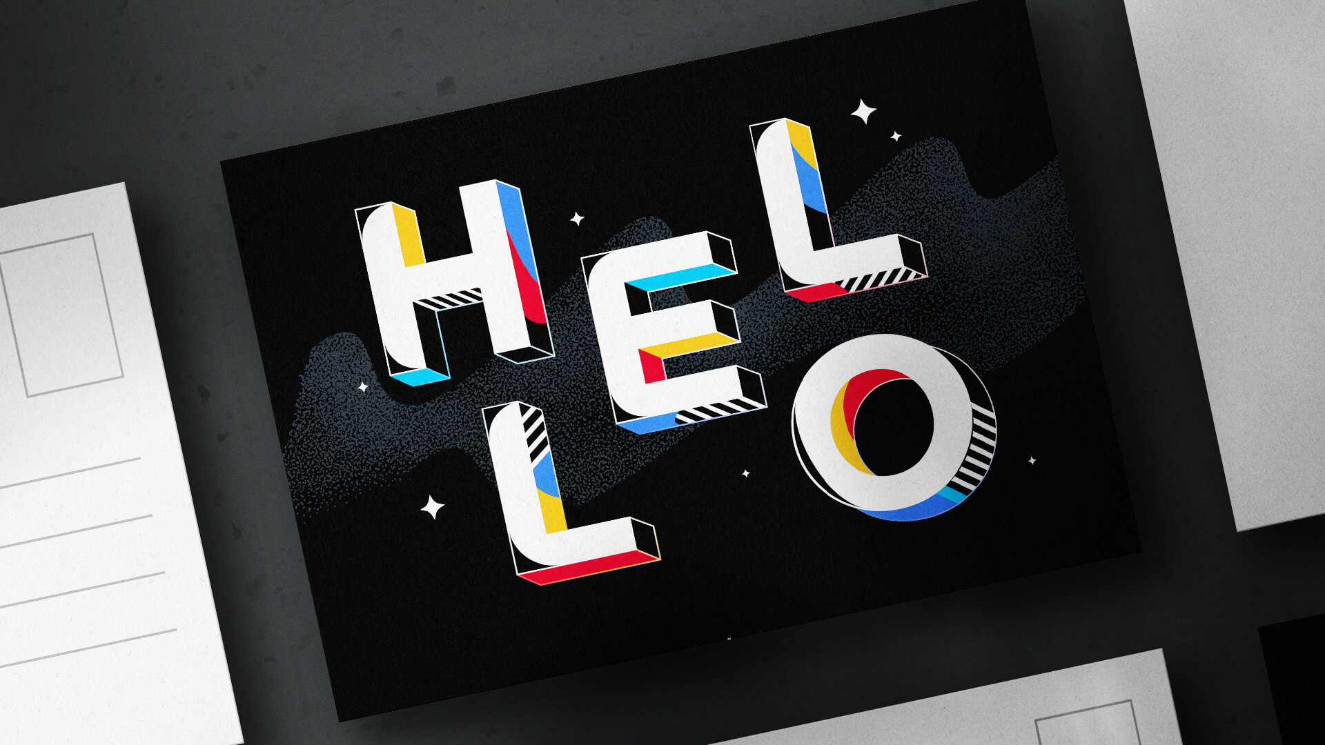 Postcard with colorful 3D “HELLO” lettering on black.